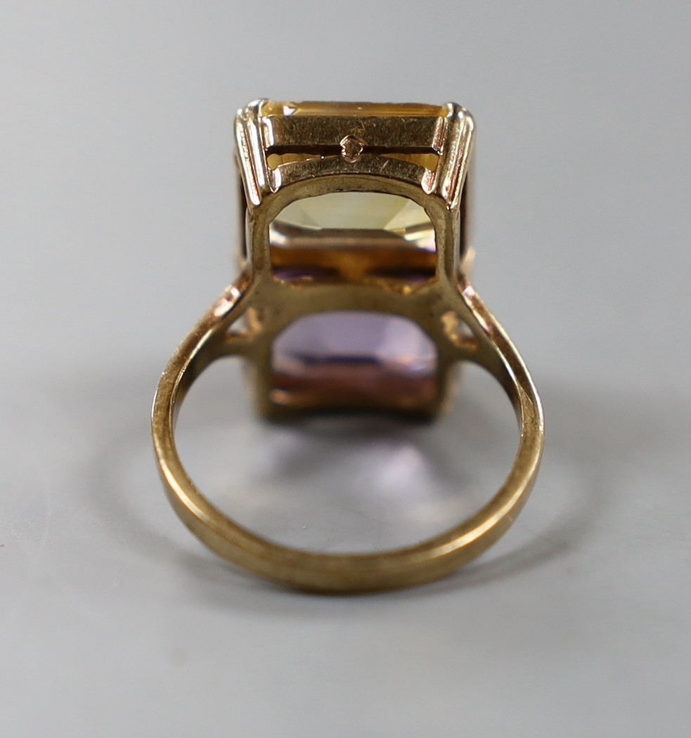 A mid 20th century 9ct gold, amethyst and citrine set two stone dress ring, size N, gross weight 5.2 grams.